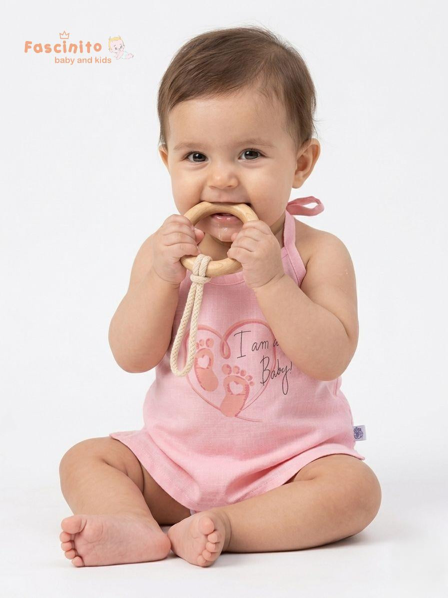 Baby wearing pink cotton knotted jhabla top by Fascinito