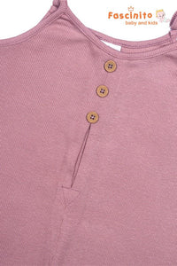 Close-up of dusty rose ribbed baby playsuit with front button detail and sleeveless cotton design