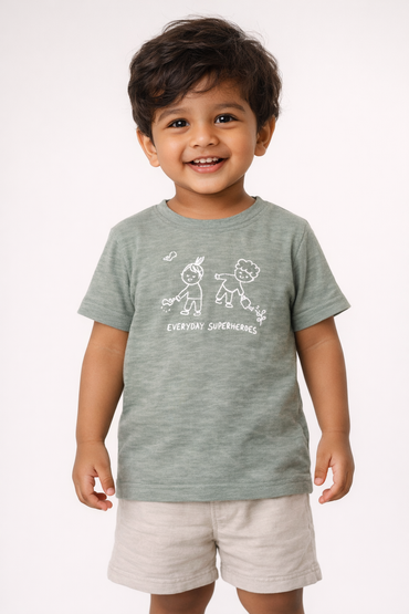 Boy wearing Fascinito sage green everyday superheroes graphic cotton tshirt