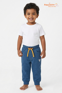 Toddler boy wearing Fascinito blue cotton drawstring pants