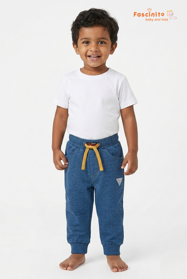 Toddler boy wearing Fascinito blue cotton drawstring pants