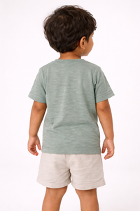 Back view of boy wearing Fascinito sage green cotton tshirt