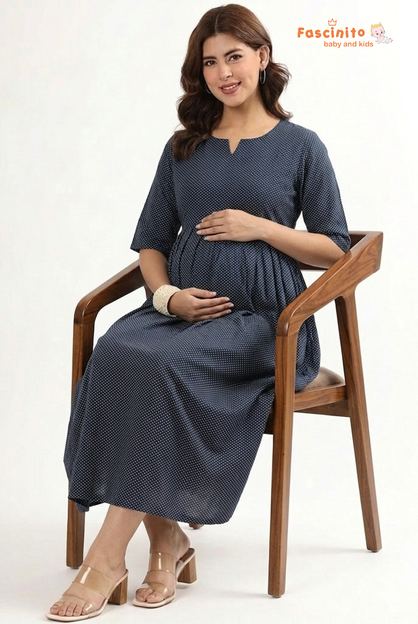 Pregnant woman wearing blue dotted maternity nursing maxi dress by Fascinito